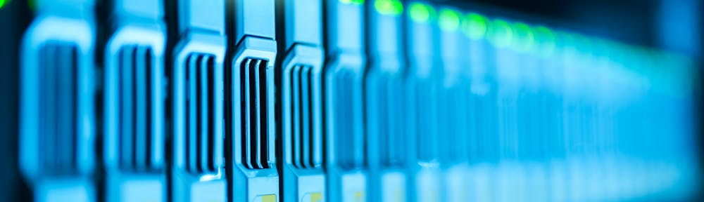 Detailed image of a server rack with glowing lights in a modern data center.
